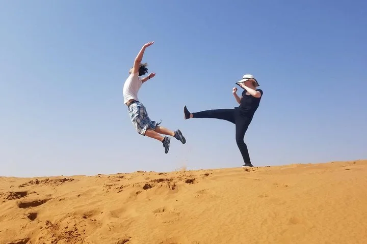 4 Hours Dubai Desert Experience: Camel + Sandboard + Falcon Photo