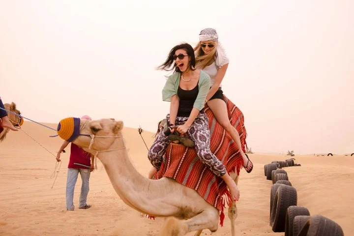 Camel Ride in Desert with Dune Bashing, BBQ Dinner and Belly Dance