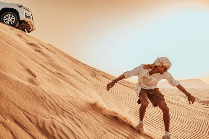 Deluxe Sunset Desert Safari: SandSurfing, Camel Ride & BBQ dinner