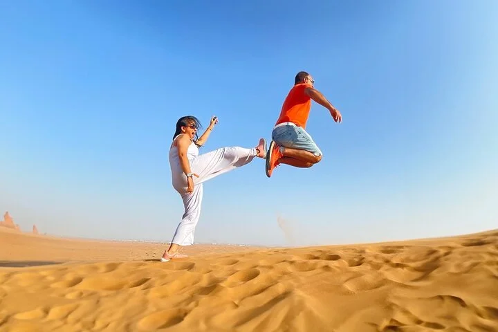 Evening Desert Safari Camel, Falcon, Sandboarding BBQ & Shows