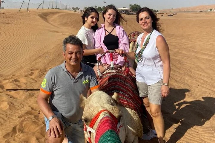 Evening Desert Safari with BBQ Dinner, Sandboarding and Camel Ride Experience