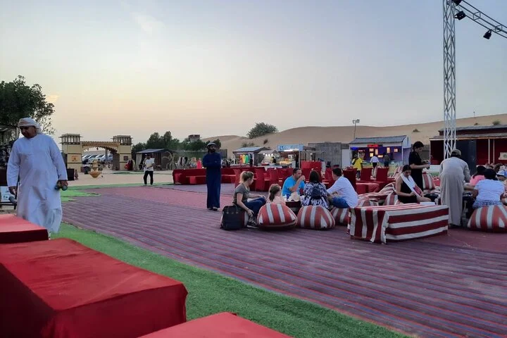 Evening Desert Safari with BBQ Dinner, Sandboarding and Camel Ride Experience