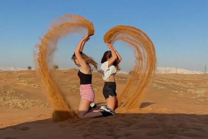 Evening Desert Safari with BBQ Dinner, Sandboarding and Camel Ride Experience