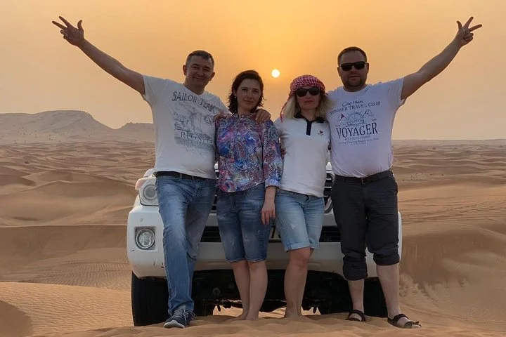 Morning Camel Trekking with Dune Bashing and Sand Boarding