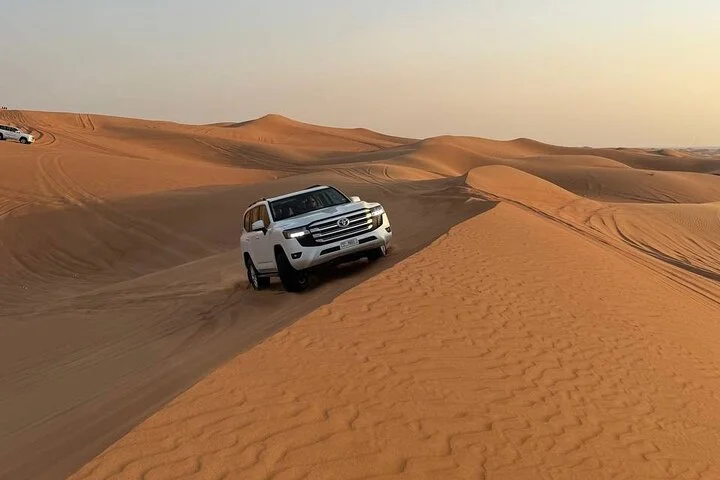 Morning Desert Safari with Quad Bike, Camel Ride & Sandboarding