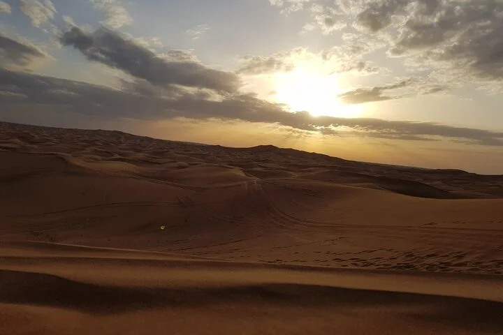 Morning Thrilling Dune bashing , Send Boarding & Camel ride