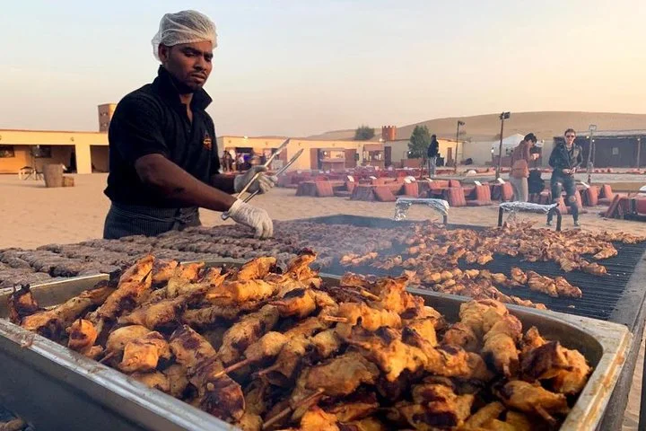 Private Evening Desert Safari with BBQ Dinner, Camel Ride And Sand Boarding